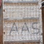 The wicker lid has been strengthened by the addition of wooden braces attached with metal straps above and below the lid. The lid is attached to the basket at the back with strong metal rings. The large black stencilled letters "A A S" can be seen on the lid.