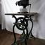 Metal treadle machine with wooden platform