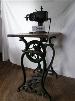 Metal treadle machine with wooden platform