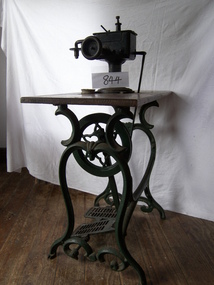 Metal treadle machine with wooden platform