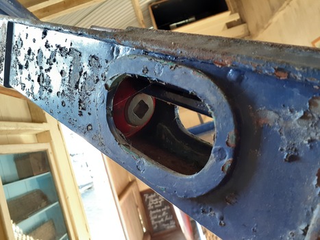 Red rocket head is visible through access slot in the rocket launching machine