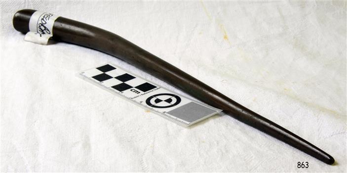 Spike has bulbous handle tapering to a rounded point at the other end