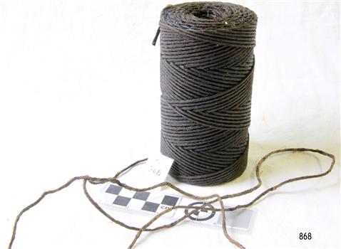 Upright reel of brown sailmaker's twin, with a few loose strands