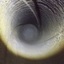 Round image of the inside of the cannon's barrel