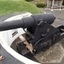 Cannon with tools around it and protective hill behind it