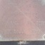 Brass metal restoration plate with stamped characters.