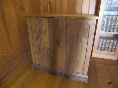 Plain wooden cupboard with two doors.