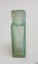 Side view of pill bottle shows varying thickness of glass
