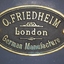 Oval metal plate with embossed text