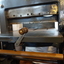 The front handle is attached to a gear below the bed