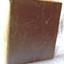Purple hard cover bound book with stains and marks on surface