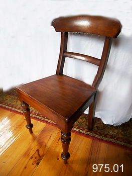 Brown wooden chair with curved backrest