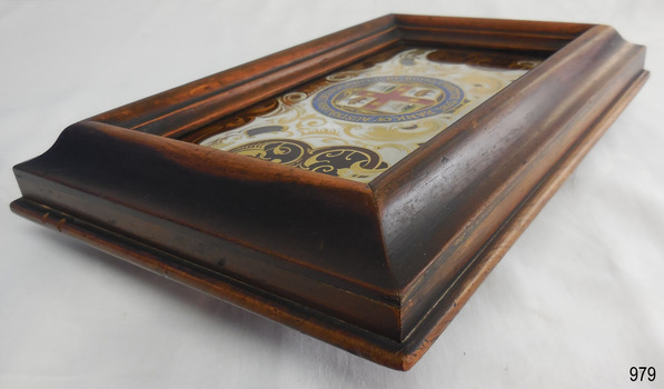 Wooden frame comprises several lavers of wood joined to made a solid frame