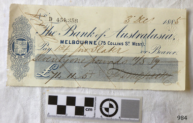 Cheque printed in blue with Bank's insignia and watermark. Stamped number. Handwritten details.