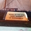 Rectangular plaque bearing details of the maker