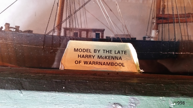 Rectangular plaque bearing details of the maker