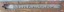 Inscription written in pen within carved out rectangle in matte