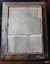 Inscriptions handwritten in ink on back with ship details, history, and presentation informaiton