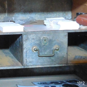 There is a secure, locked metal drawer inside the safe that has a pull-handle.