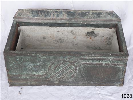 Large metal covered wooden ash tray with a logo in the front panel