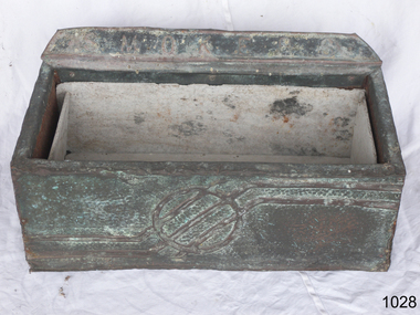 Large metal covered wooden ash tray with a logo in the front panel