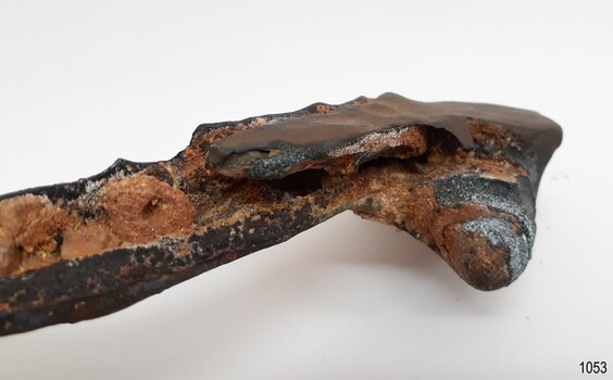The hinge has corroded and looks like part of the channeled frame