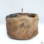 Metal nail is fixed near the centre of the dead eye, with part of the shaft and head raised