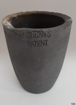 Grey container with downward sloping sides