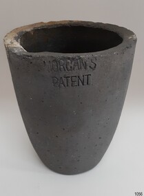 Grey container with downward sloping sides