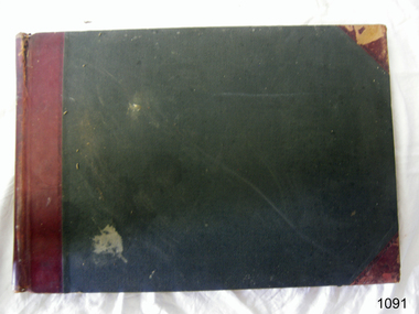 Hardcover rectangular book with pre-printed columns and rows on the pages