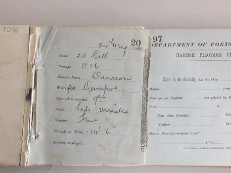 Handwritten inscription on butt in front of book