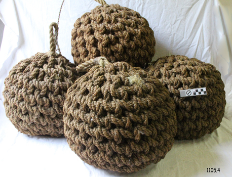Round knotted rope-covered balls with a rope loop on each; set of four