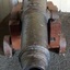 Barrel has decorative concentric rings on the outside at the front. Carriage wheels are wooden.