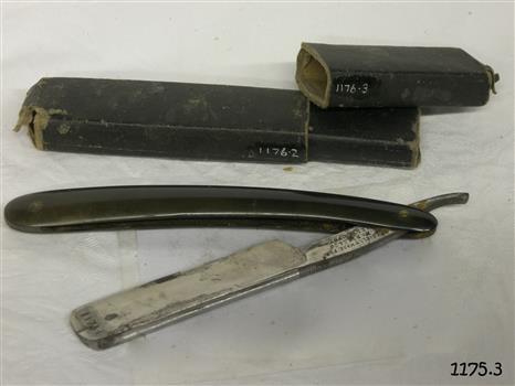 Box and razor show signs of wear. Handle and box are black