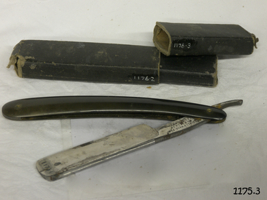 Box and razor show signs of wear. Handle and box are black