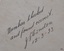 Inscription is handwritten in pen, signed and dated