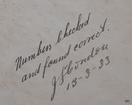 Inscription is handwritten in pen, signed and dated