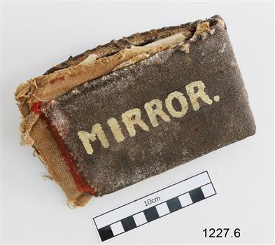 Hard cover over fabric pouch for holding a mirror
