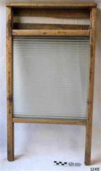 Wooden framed glass washboard with two legs