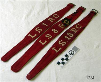 These three scarlet armbands were fastened by the metal buckles