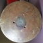 Metal base facing viewer with stamped and painted inscriptions