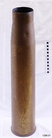 Upright brass cylinder with wide mouth and tapered shoulders. Base has a ridge around circumference