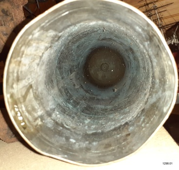 Shell on bench, view inside from mouth to base showing concentric lines in mouth and down sides
