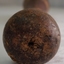 Wooden handle is a knob with indented marks