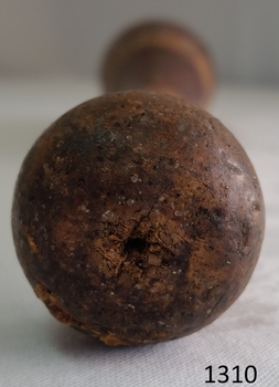 Wooden handle is a knob with indented marks