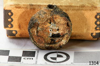 Metal pocket watch covered with encrustation,. 