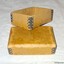 Base and lid are strong cardboard and all corners are reinforced with metal