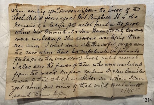 Rectangular cream paper with black script handwriting and fold-lines