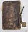 Brown leather back cover and remnant of spine, with decorative gold embossing