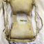 Jacket us spread open showing shoulder straps and waist ties